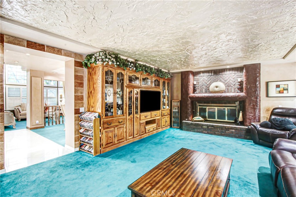 7954 Thoroughbred Street Rancho Cucamonga, CA 91701 - Photo 16 of 63 a living room with furniture and a flat screen tv