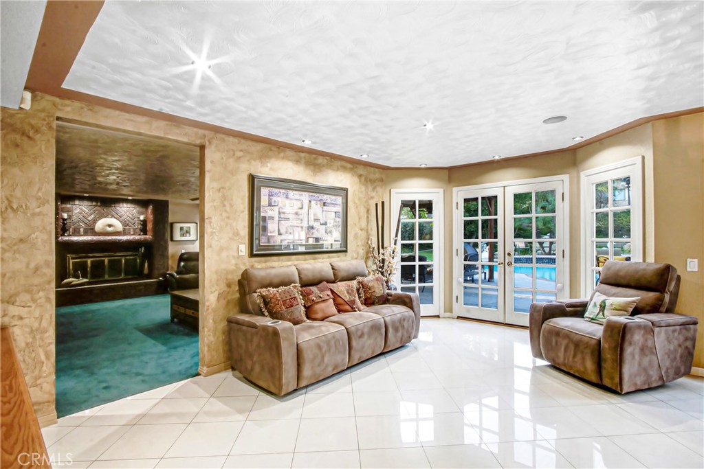 7954 Thoroughbred Street Rancho Cucamonga, CA 91701 - Photo 18 of 63 a living room with furniture and a floor to ceiling window