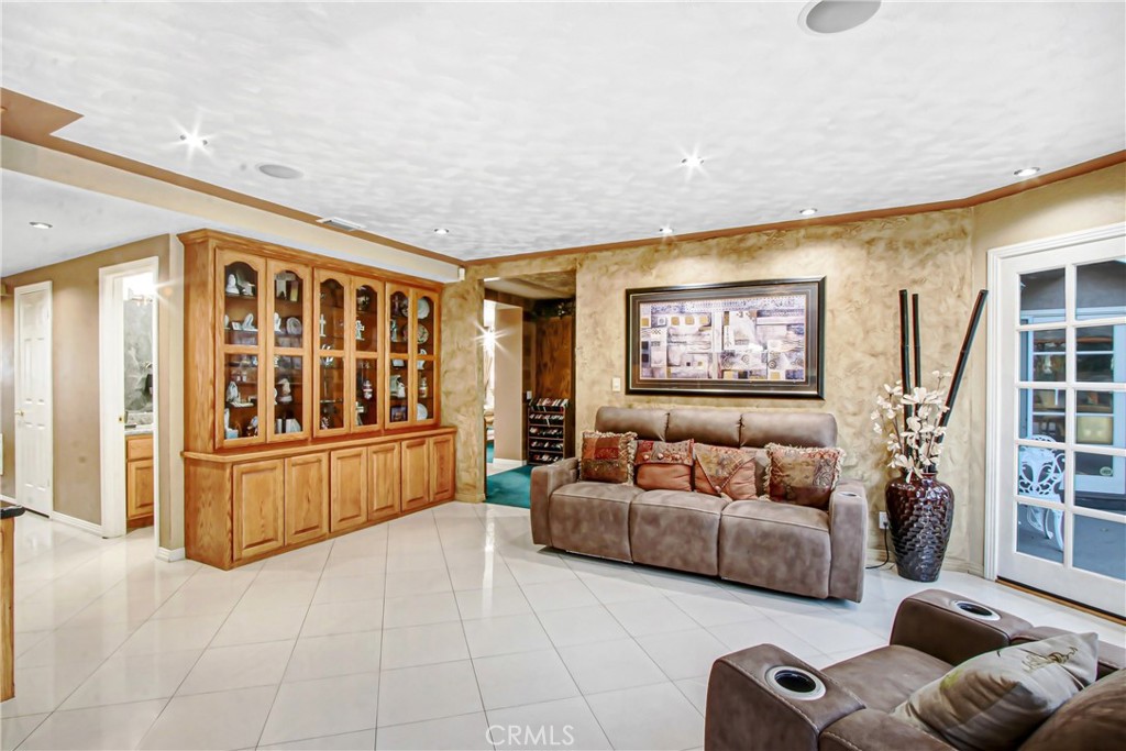 7954 Thoroughbred Street Rancho Cucamonga, CA 91701 - Photo 20 of 63 a living room with furniture and a large window