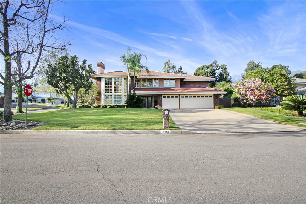 7954 Thoroughbred Street Rancho Cucamonga, CA 91701 - Photo 2 of 63 a front view of a house with a yard and garage