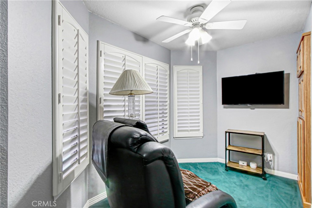 7954 Thoroughbred Street Rancho Cucamonga, CA 91701 - Photo 36 of 63 a living room with furniture and a flat screen tv