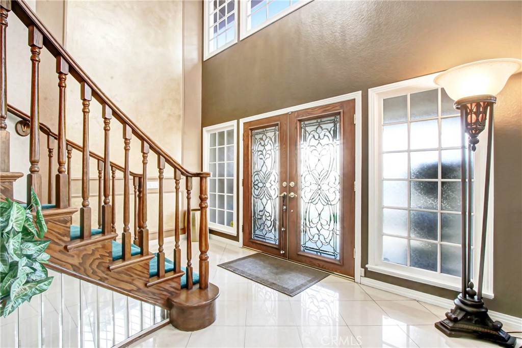 7954 Thoroughbred Street Rancho Cucamonga, CA 91701 - Photo 4 of 63 a view of entryway with wooden floor and windows
