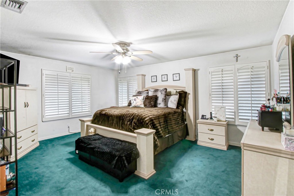 7954 Thoroughbred Street Rancho Cucamonga, CA 91701 - Photo 42 of 63 a bedroom with a bed and a window