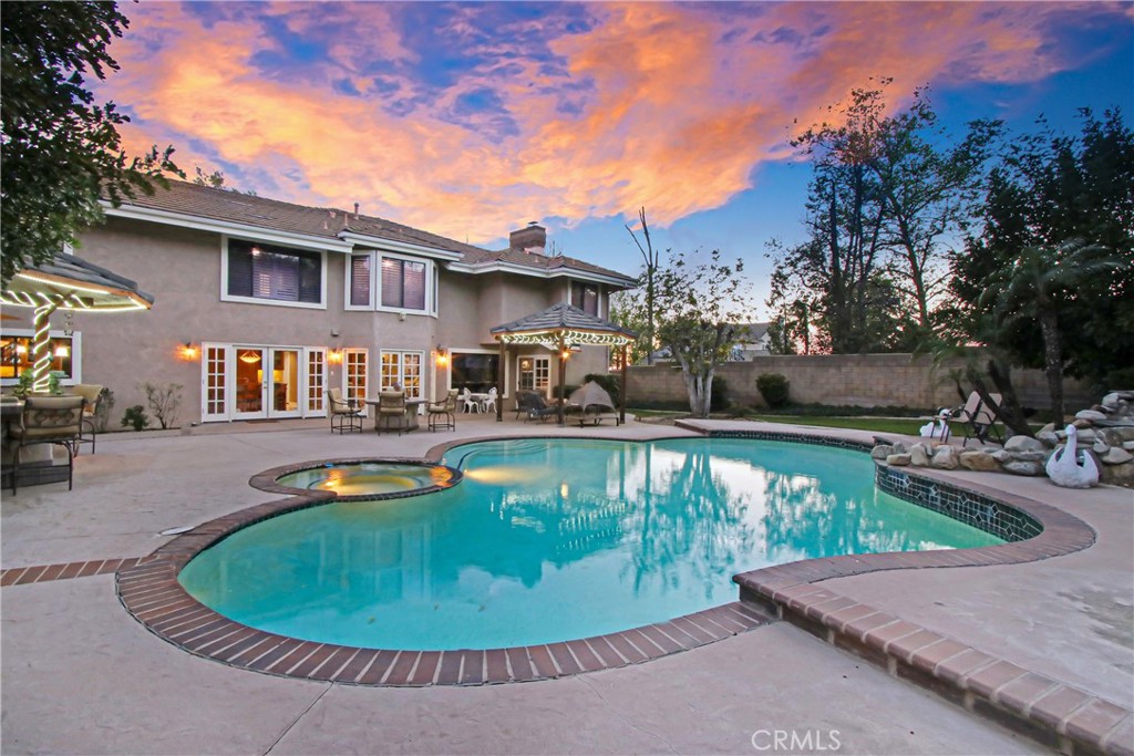 7954 Thoroughbred Street Rancho Cucamonga, CA 91701 - Photo 50 of 63 a view of a house with swimming pool and sitting area