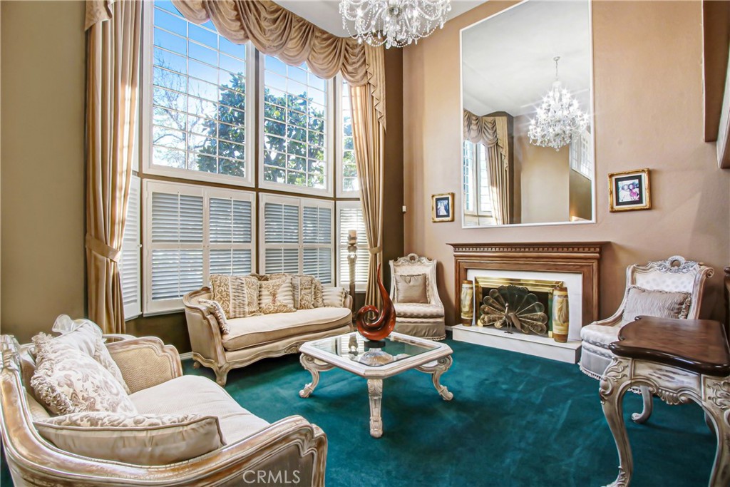 7954 Thoroughbred Street Rancho Cucamonga, CA 91701 - Photo 5 of 63 a living room with furniture and a fireplace