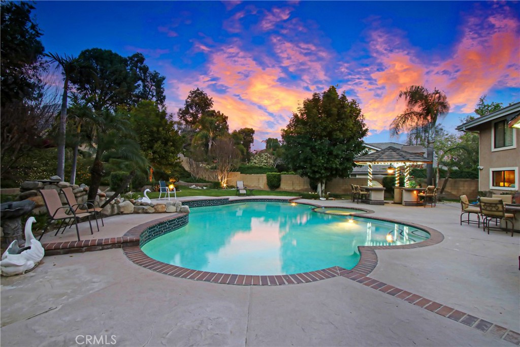 7954 Thoroughbred Street Rancho Cucamonga, CA 91701 - Photo 53 of 63 a view of a swimming pool with outdoor seating
