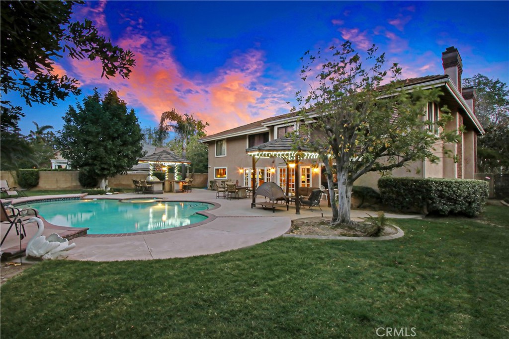 7954 Thoroughbred Street Rancho Cucamonga, CA 91701 - Photo 55 of 63 a view of a house with a patio