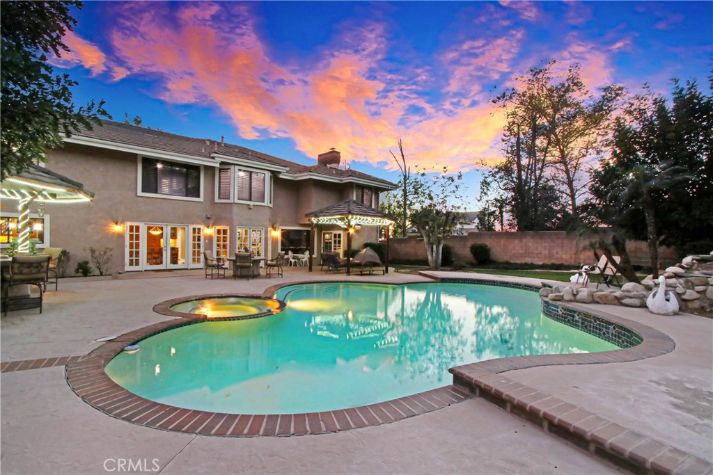 7954 Thoroughbred Street Rancho Cucamonga, CA 91701 - Photo 57 of 63 a view of a house with swimming pool and sitting area