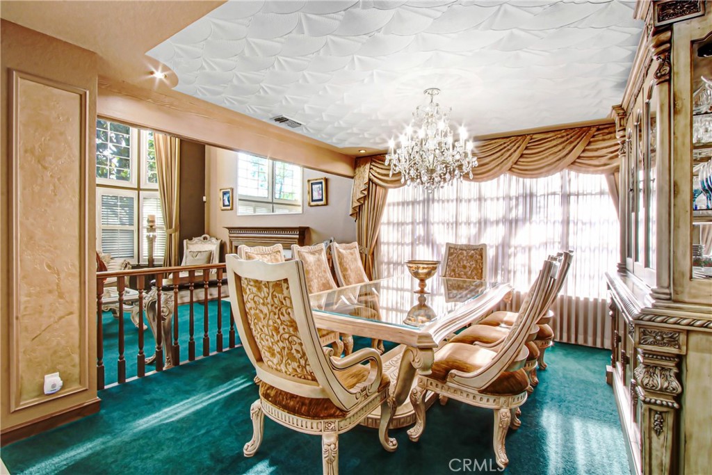 7954 Thoroughbred Street Rancho Cucamonga, CA 91701 - Photo 10 of 63 a view of a dining room with furniture window and outside view