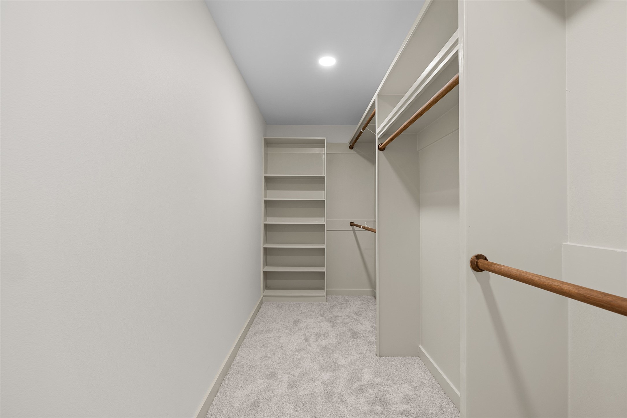 911 Eilers Street Schulenburg, TX 78956 - Photo 14 of 22 a view of walk in closet with empty racks