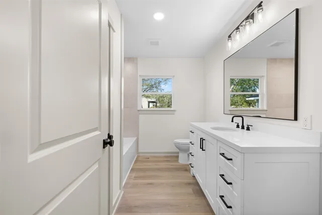 a bathroom with a sink and a window
