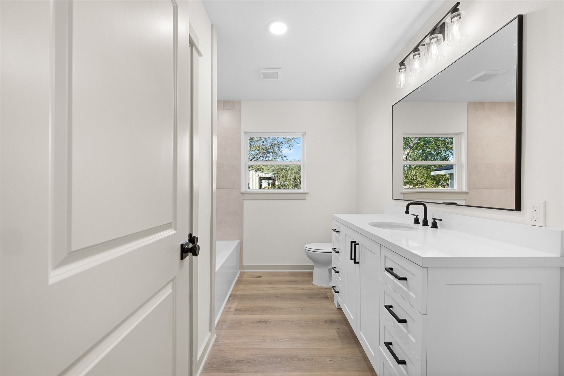 911 Eilers Street Schulenburg, TX 78956 - Photo 16 of 22 a bathroom with a sink and a window