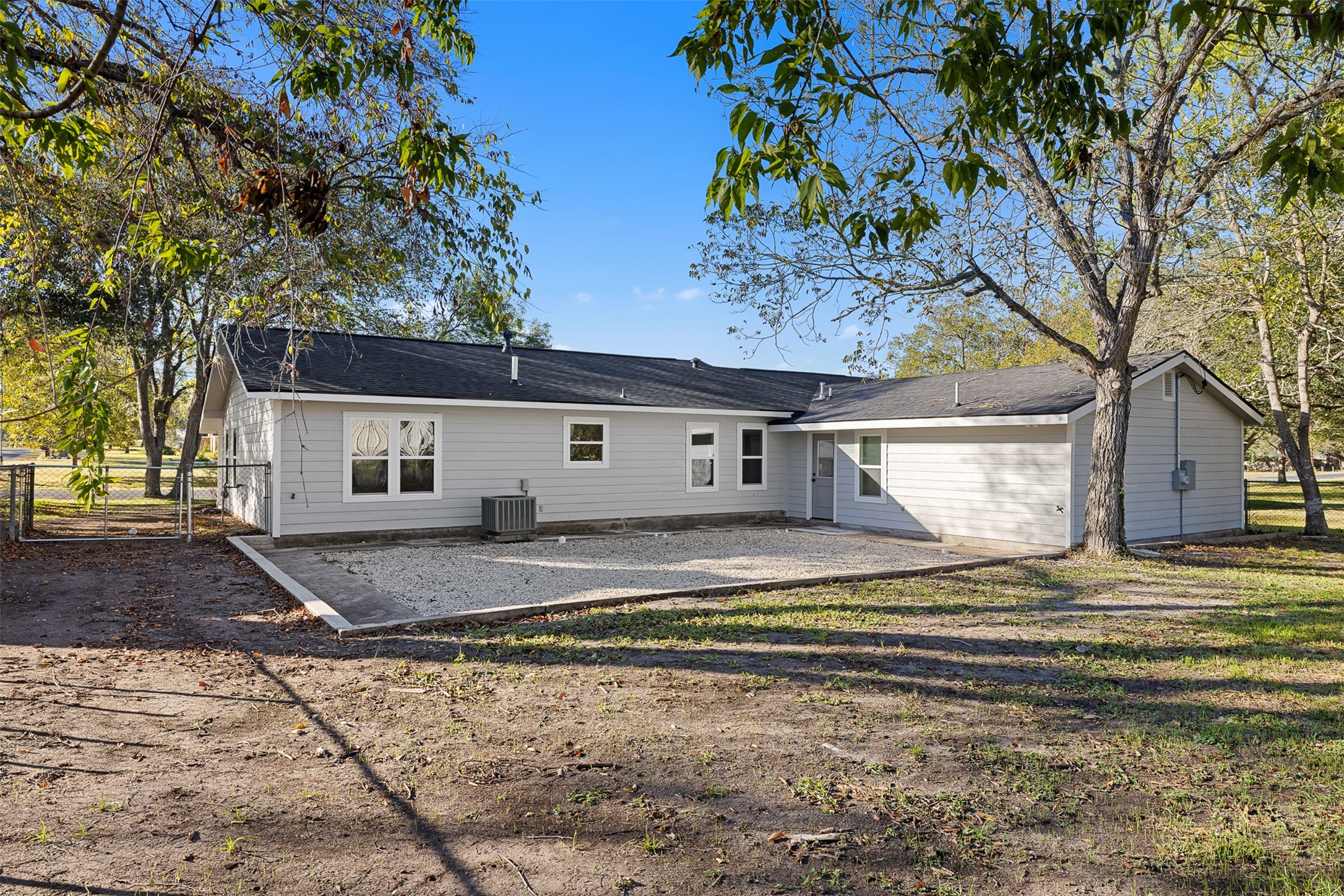 911 Eilers Street Schulenburg, TX 78956 - Photo 20 of 22 a view of a house with a yard and large tree