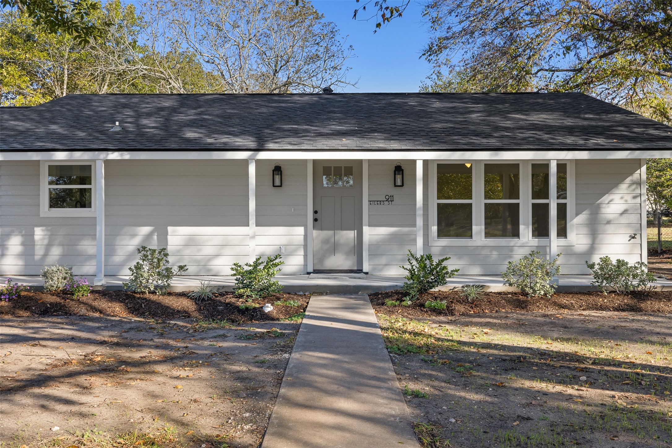911 Eilers Street Schulenburg, TX 78956 - Photo 2 of 22 a front view of a house with potted plants