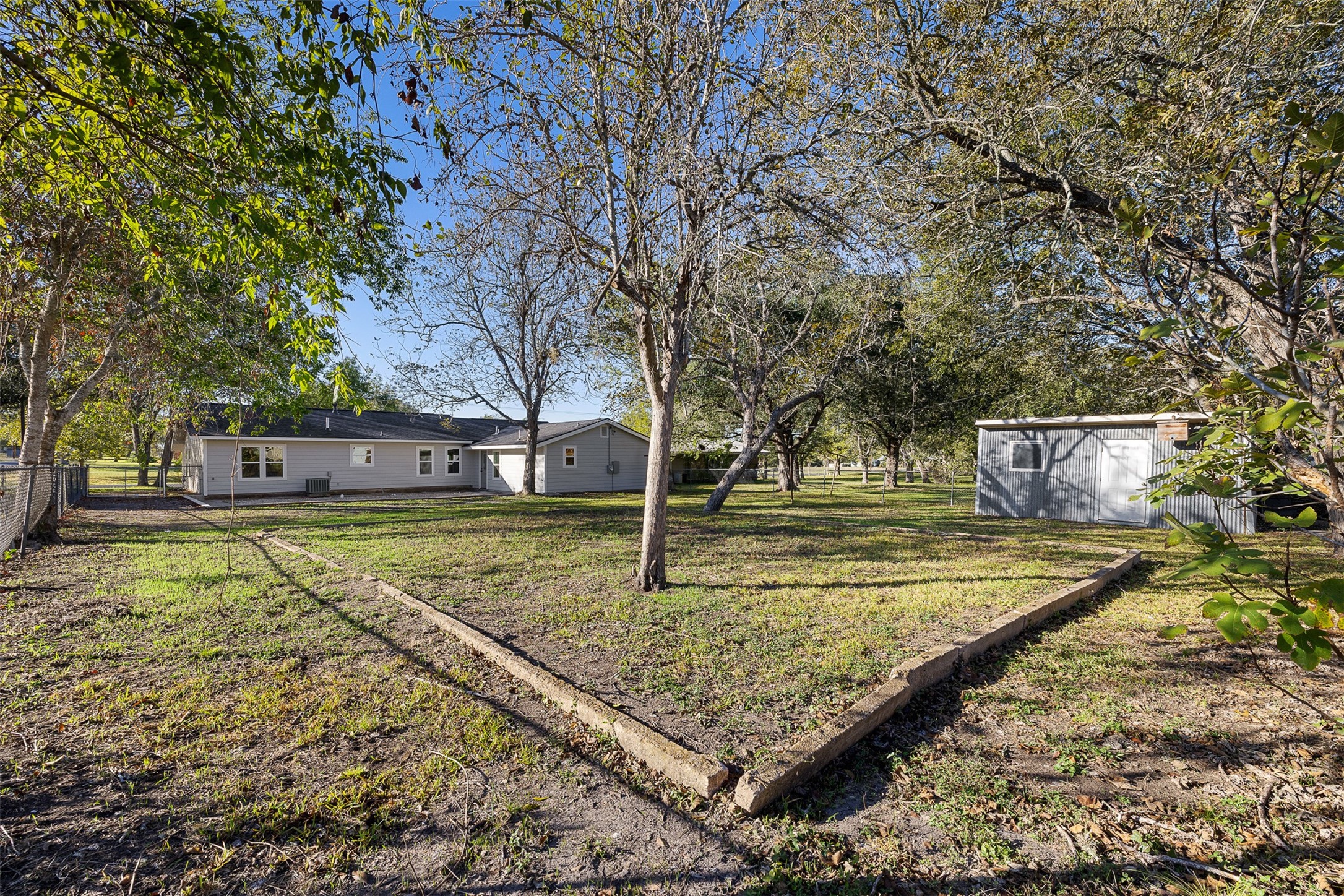 911 Eilers Street Schulenburg, TX 78956 - Photo 21 of 22 a view of a swimming pool with a yard