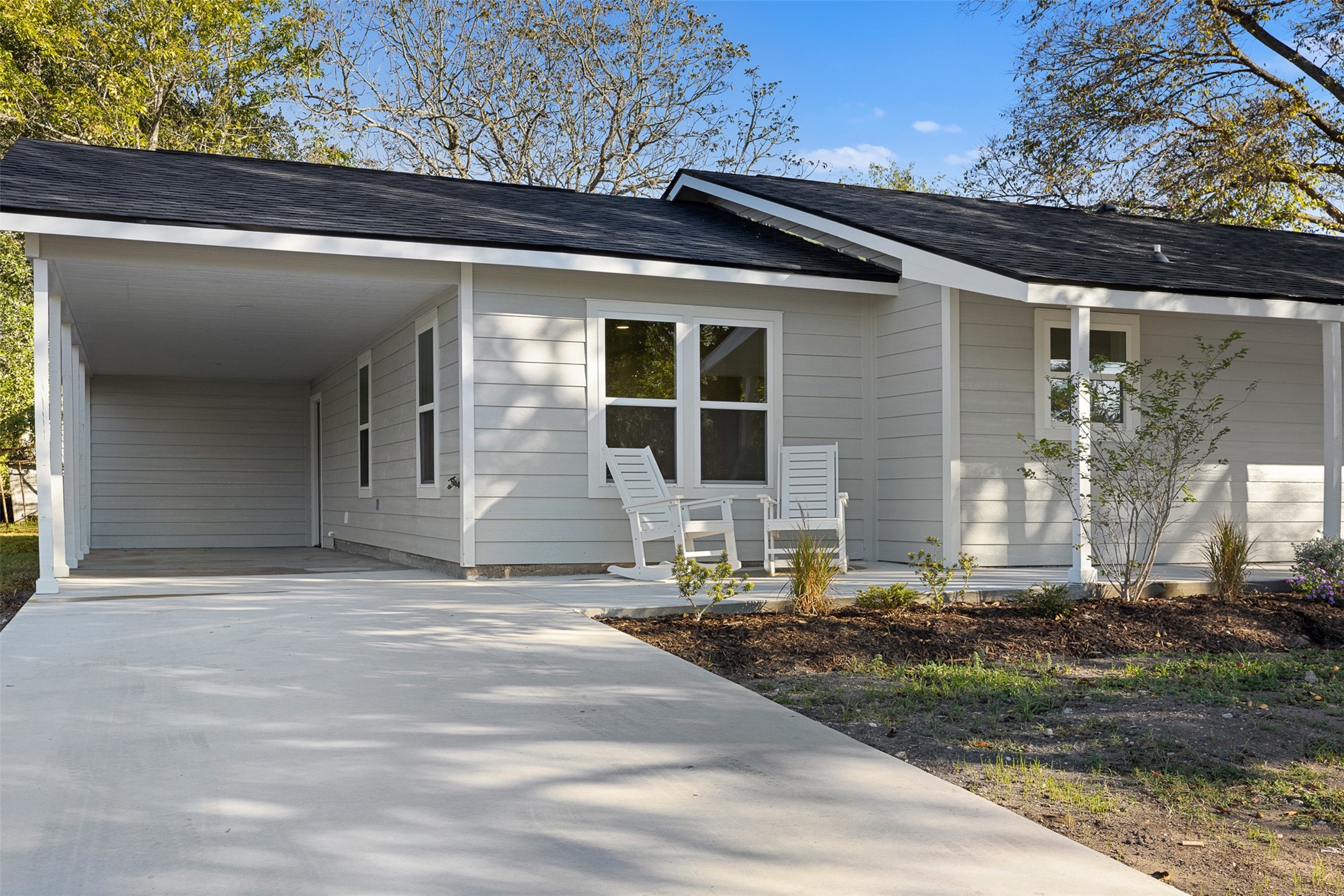 911 Eilers Street Schulenburg, TX 78956 - Photo 3 of 22 a backyard of a house with yard and outdoor seating