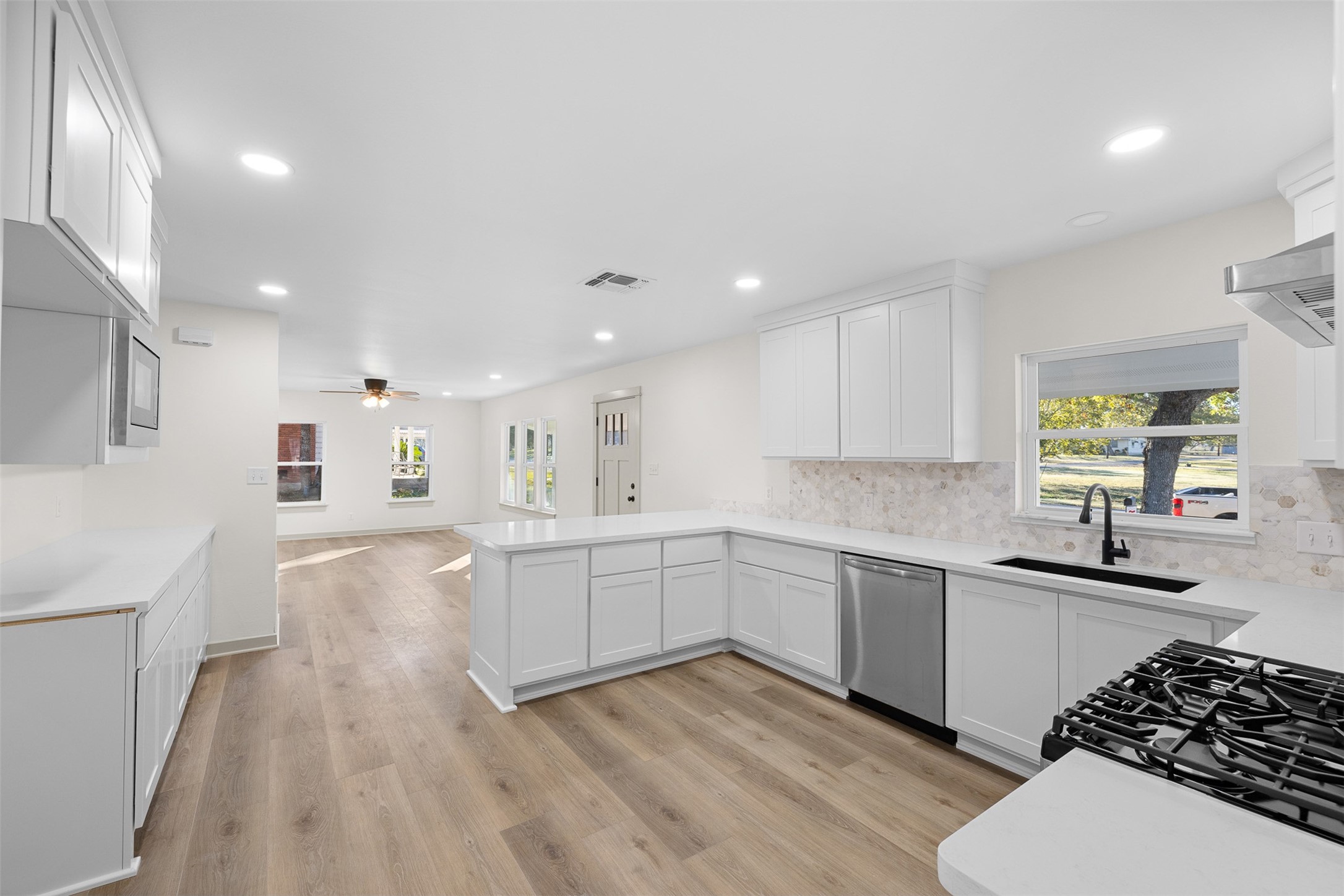 911 Eilers Street Schulenburg, TX 78956 - Photo 9 of 22 a kitchen with a sink a stove and cabinets
