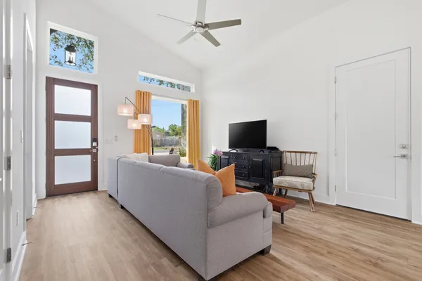 a living room with furniture and a flat screen tv