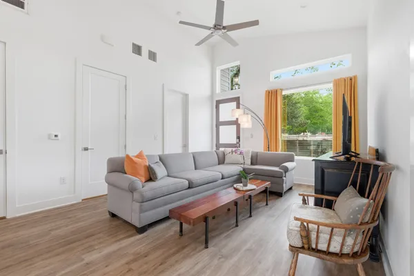 a living room with furniture and a large window