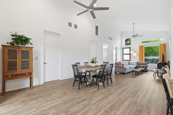 a view of a dining room with furniture window and wooden floor