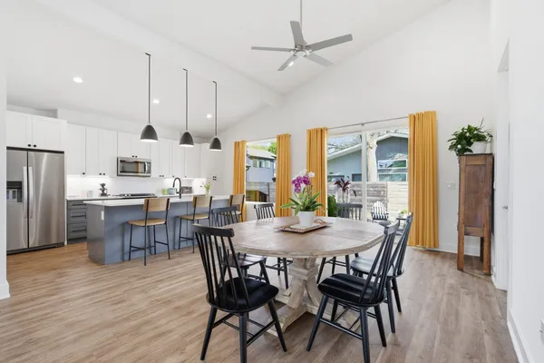 a view of a dining room with furniture window and wooden floor