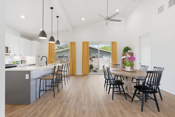 a view of a dining room with furniture window and wooden floor