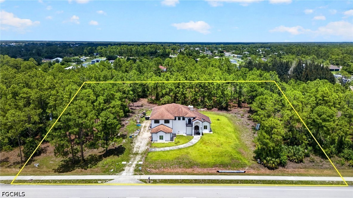 2665 Oil Well Road Naples, FL 34120 - Photo 2 of 40 an aerial view of a houses with a yard
