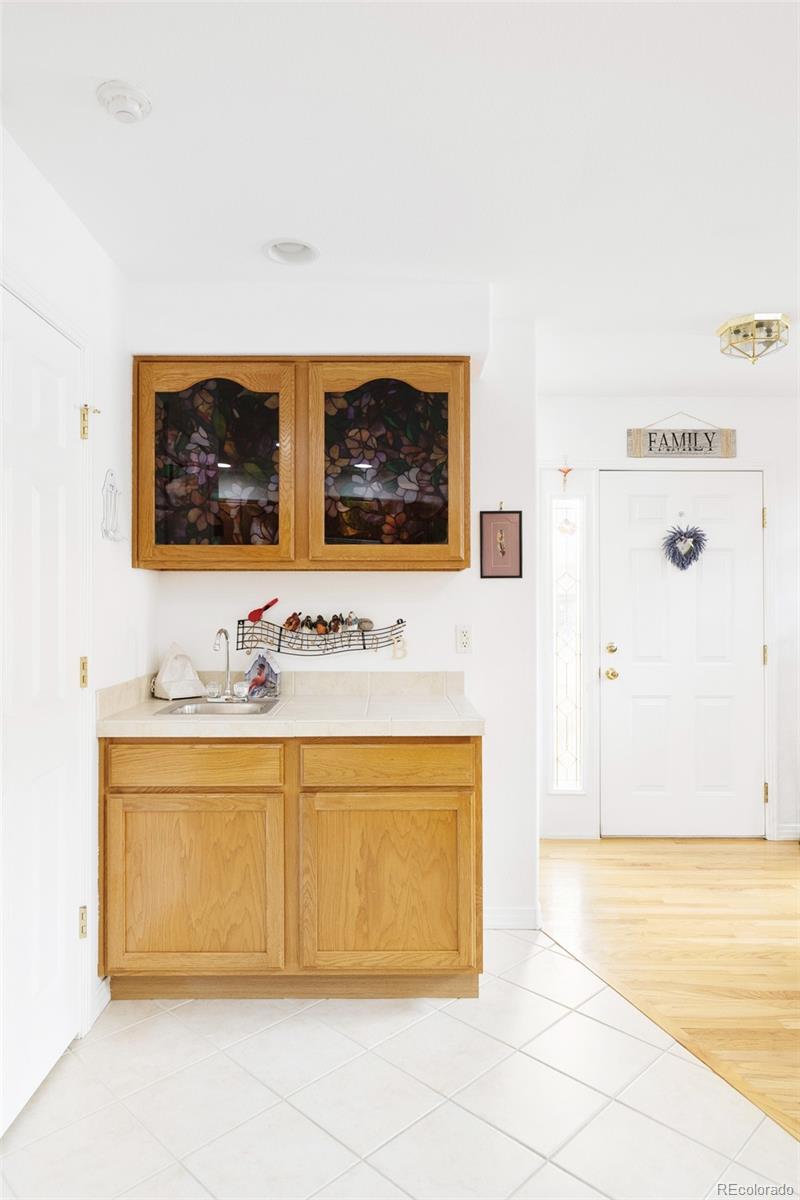 5308 Stuart Street Denver, CO 80212 - Photo 11 of 33 a bathroom with a sink and a mirror