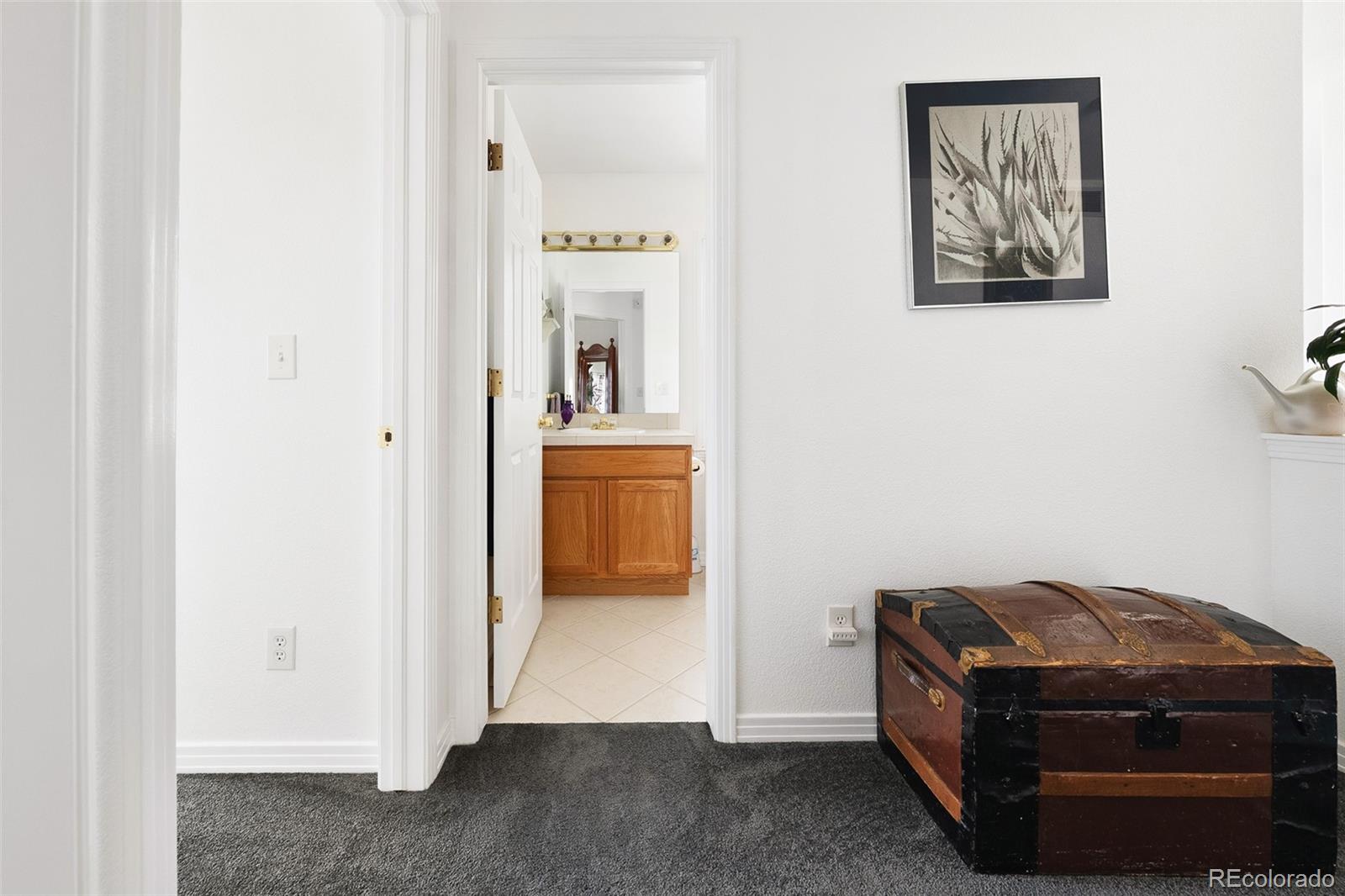 5308 Stuart Street Denver, CO 80212 - Photo 20 of 33 a room with a bed and a painting on the wall