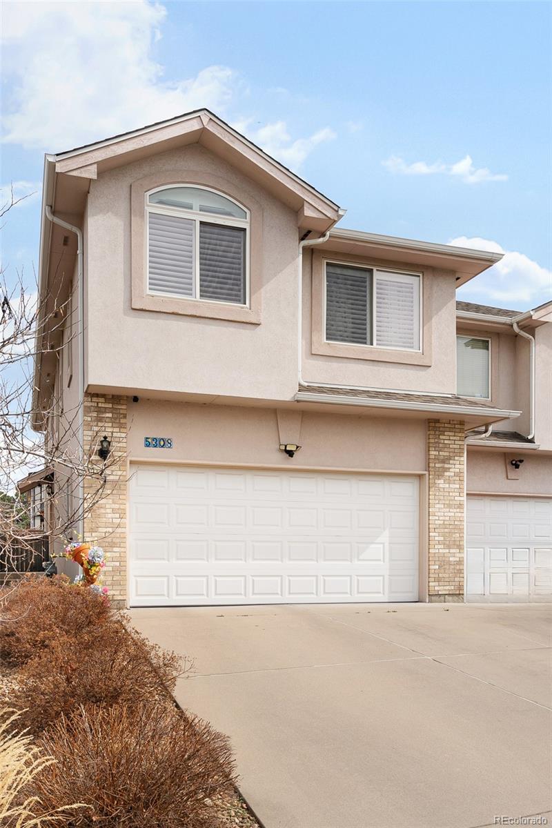 5308 Stuart Street Denver, CO 80212 - Photo 2 of 33 a front view of a house with garage