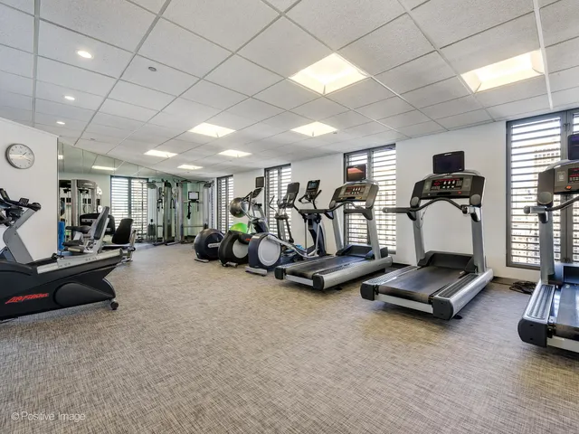 a view of a balcony with chairs and a table