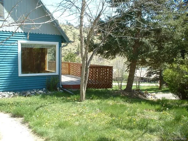 a backyard of a house with lots of green space