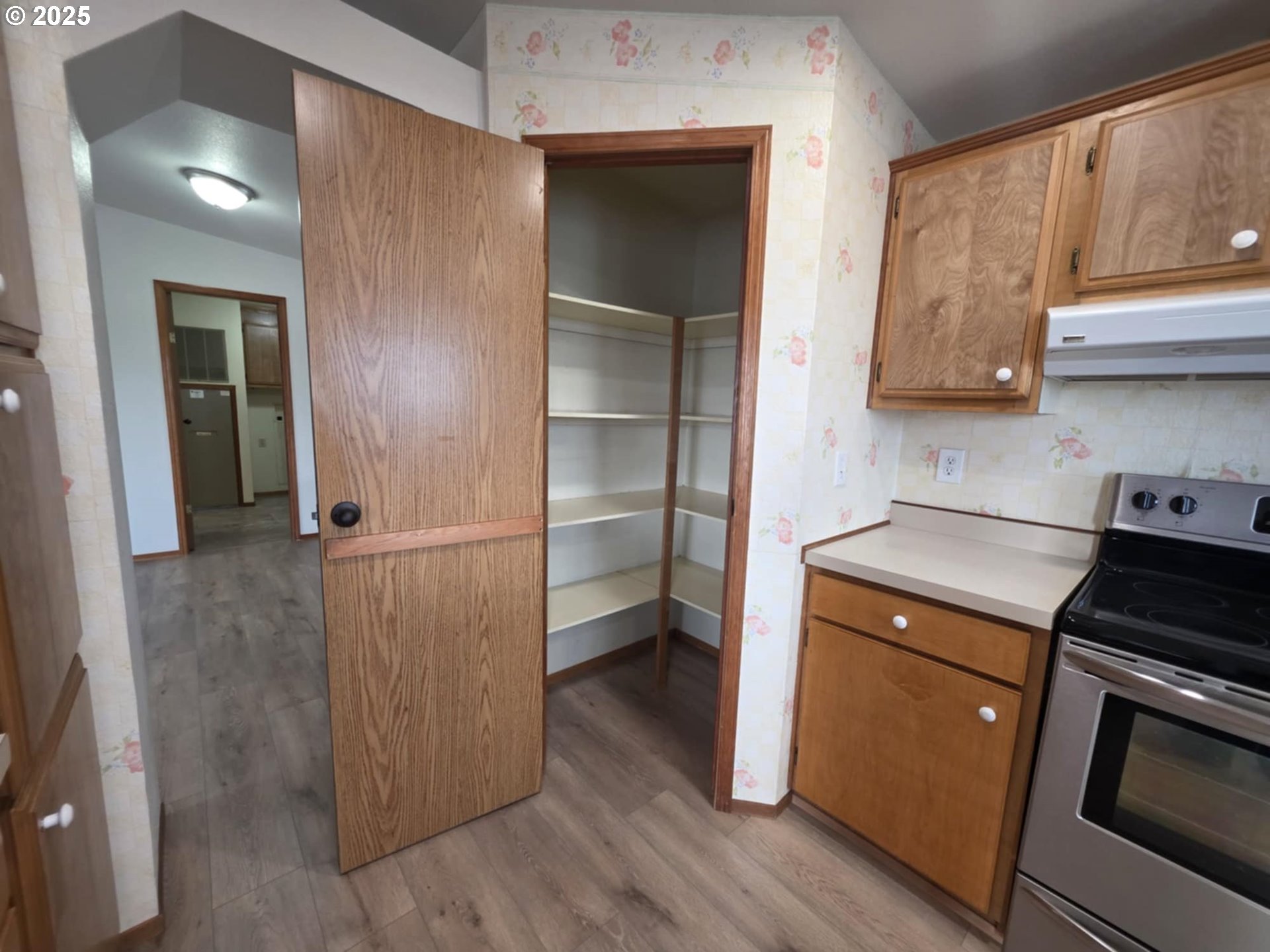 1402 Pioneer Way Forest Grove, OR 97116 - Photo 12 of 26 a kitchen with a refrigerator and a stove