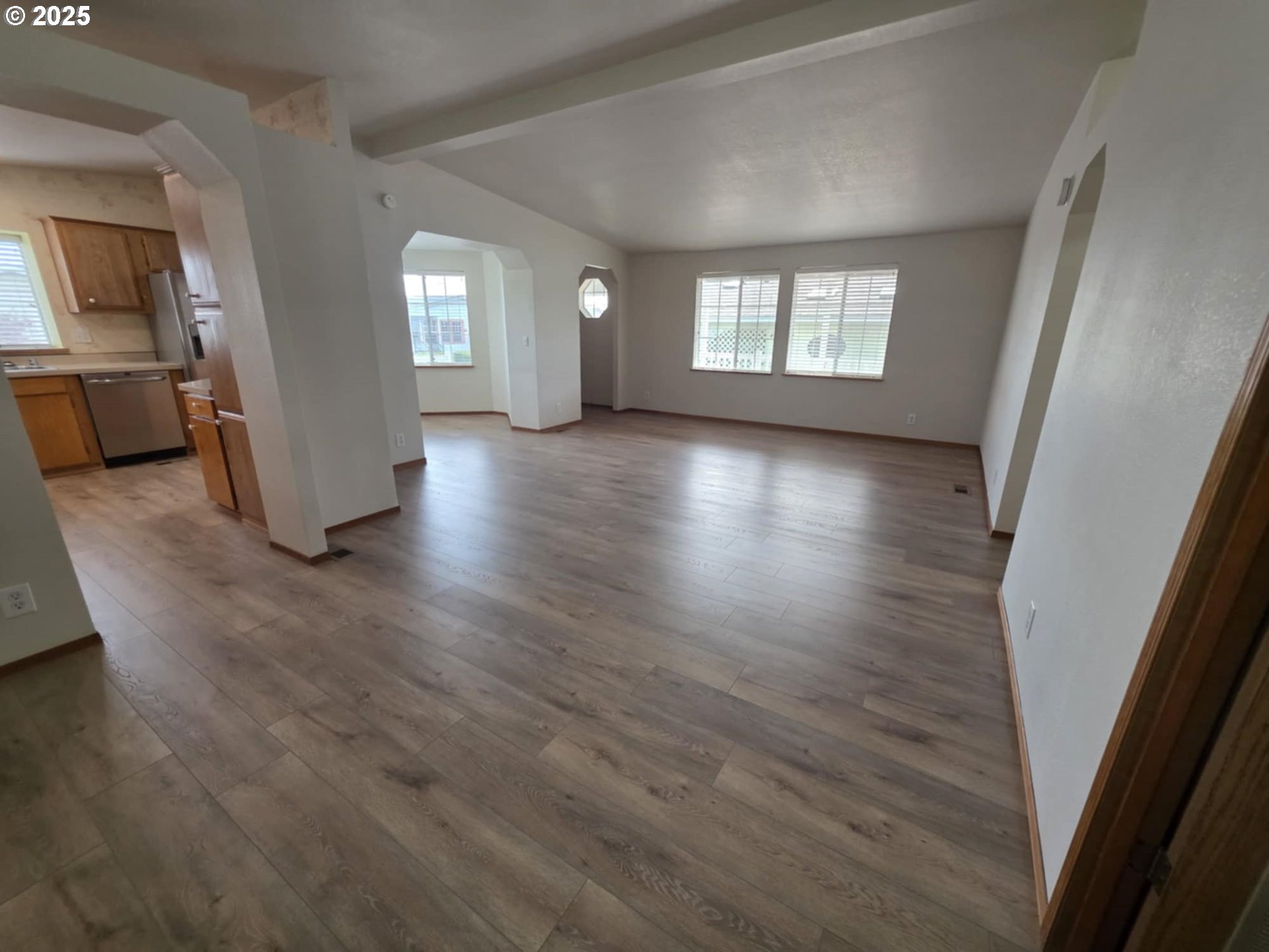 1402 Pioneer Way Forest Grove, OR 97116 - Photo 17 of 26 an empty room with wooden floor and windows