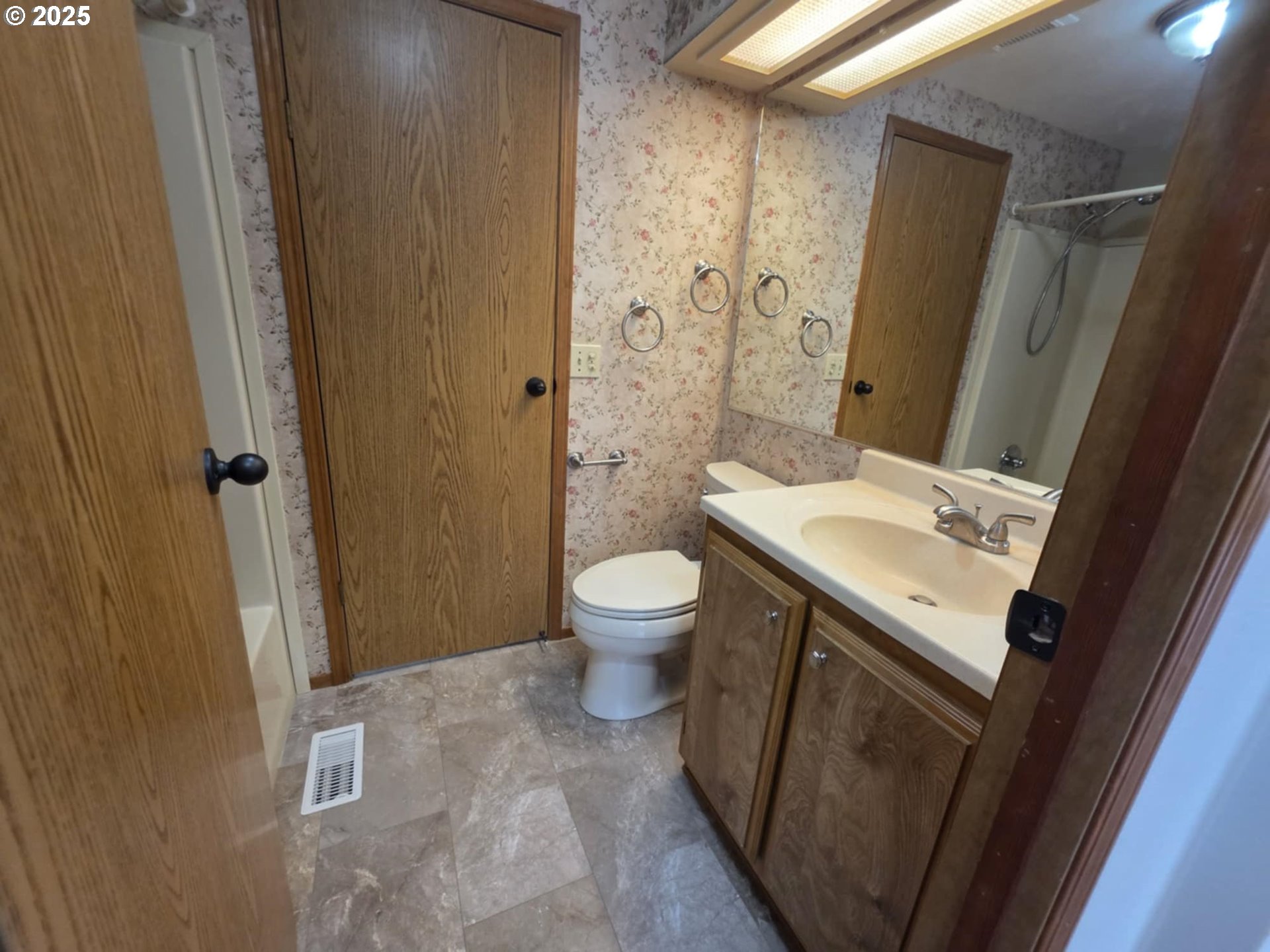 1402 Pioneer Way Forest Grove, OR 97116 - Photo 20 of 26 a bathroom with a granite countertop sink toilet and shower