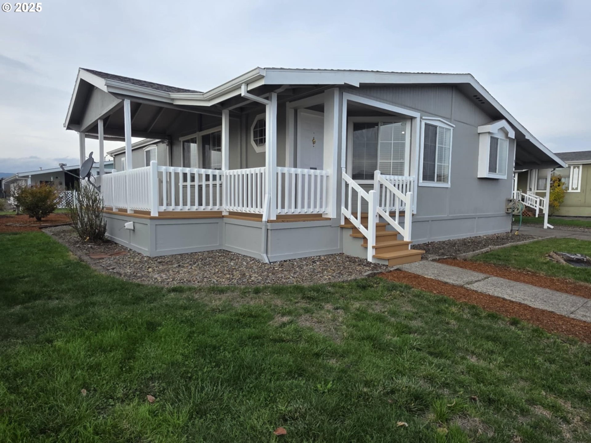 1402 Pioneer Way Forest Grove, OR 97116 - Photo 2 of 26 a view of a house with a yard and deck