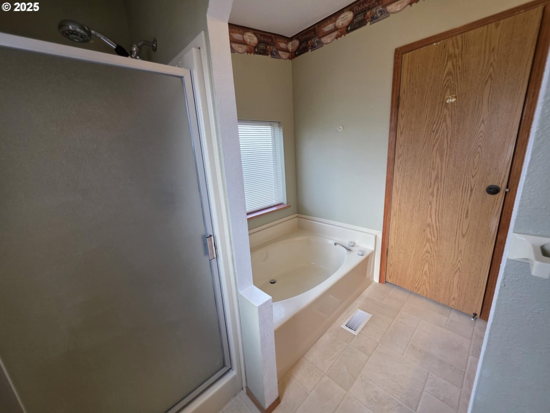 1402 Pioneer Way Forest Grove, OR 97116 - Photo 24 of 26 a bathroom with a tub shower and sink