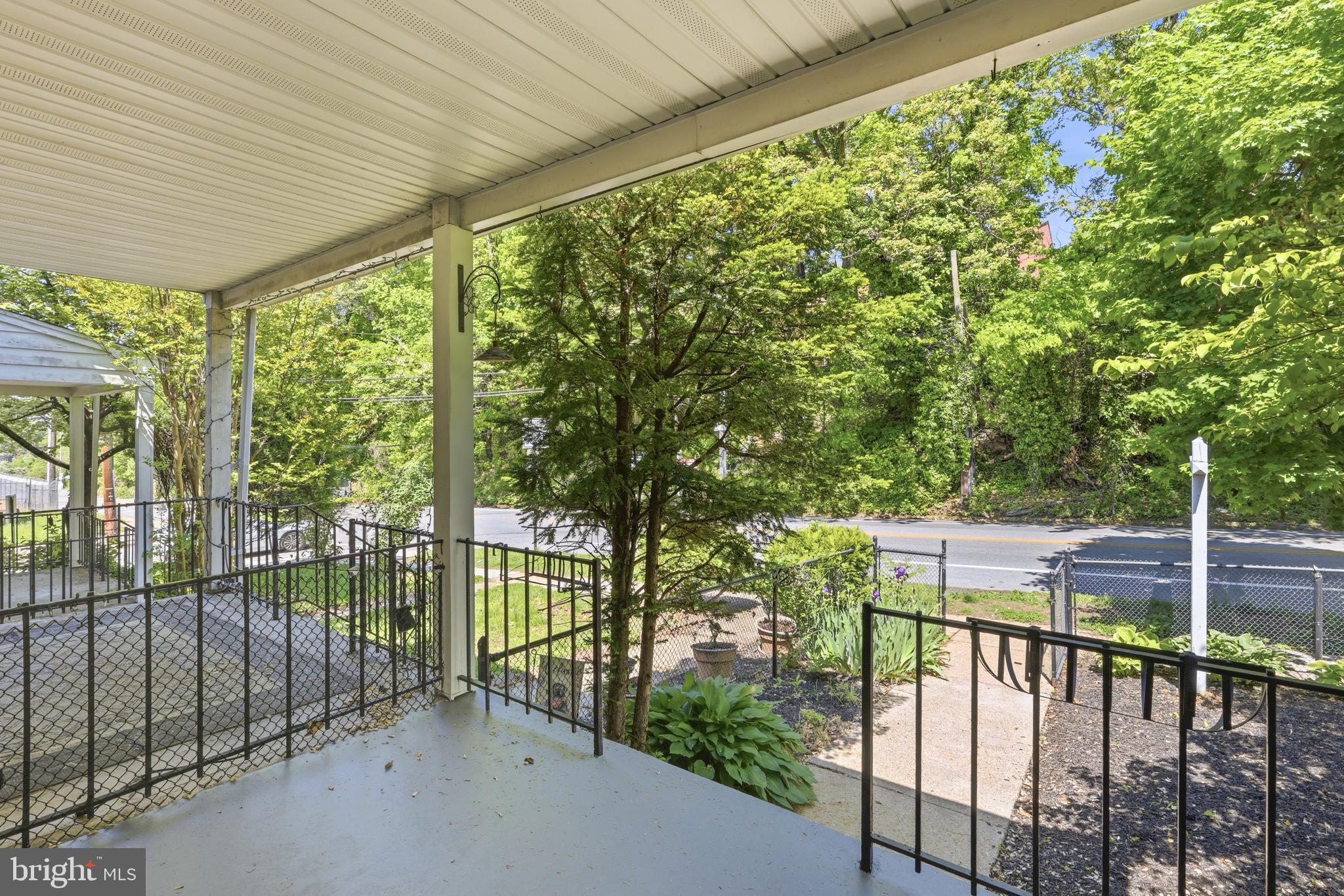 1421 West 41st Street Baltimore, MD 21211 - Photo 3 of 43 Front porch overlooking fully fenced front yard