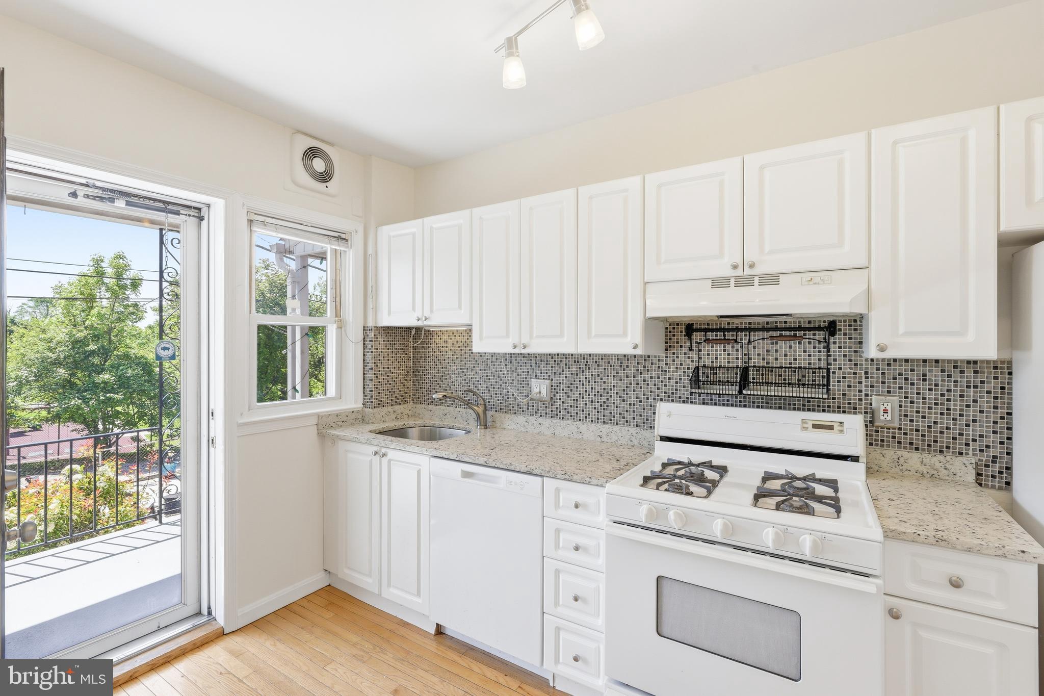 1421 West 41st Street Baltimore, MD 21211 - Photo 8 of 43 Updated kitchen with gas stove & granite
