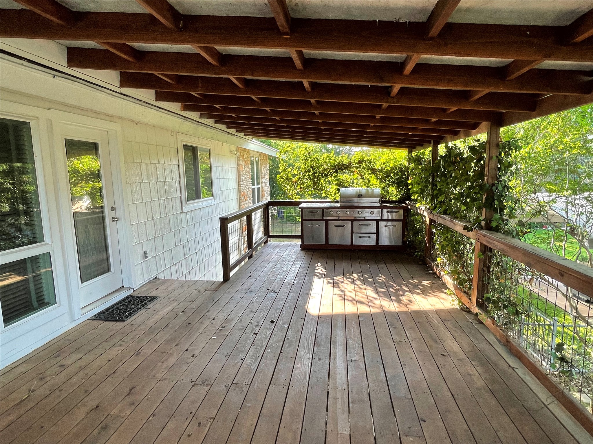 5802 Longhorn Landing Austin, TX 78734 - Photo 35 of 38 Wooden deck featuring an outdoor kitchen