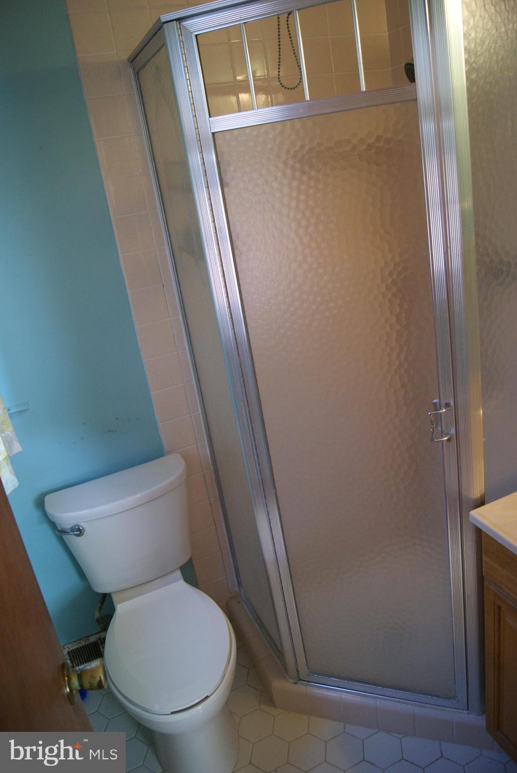 7314 Hill Road Philadelphia, PA 19128 - Photo 17 of 68 a white toilet sitting next to a sink