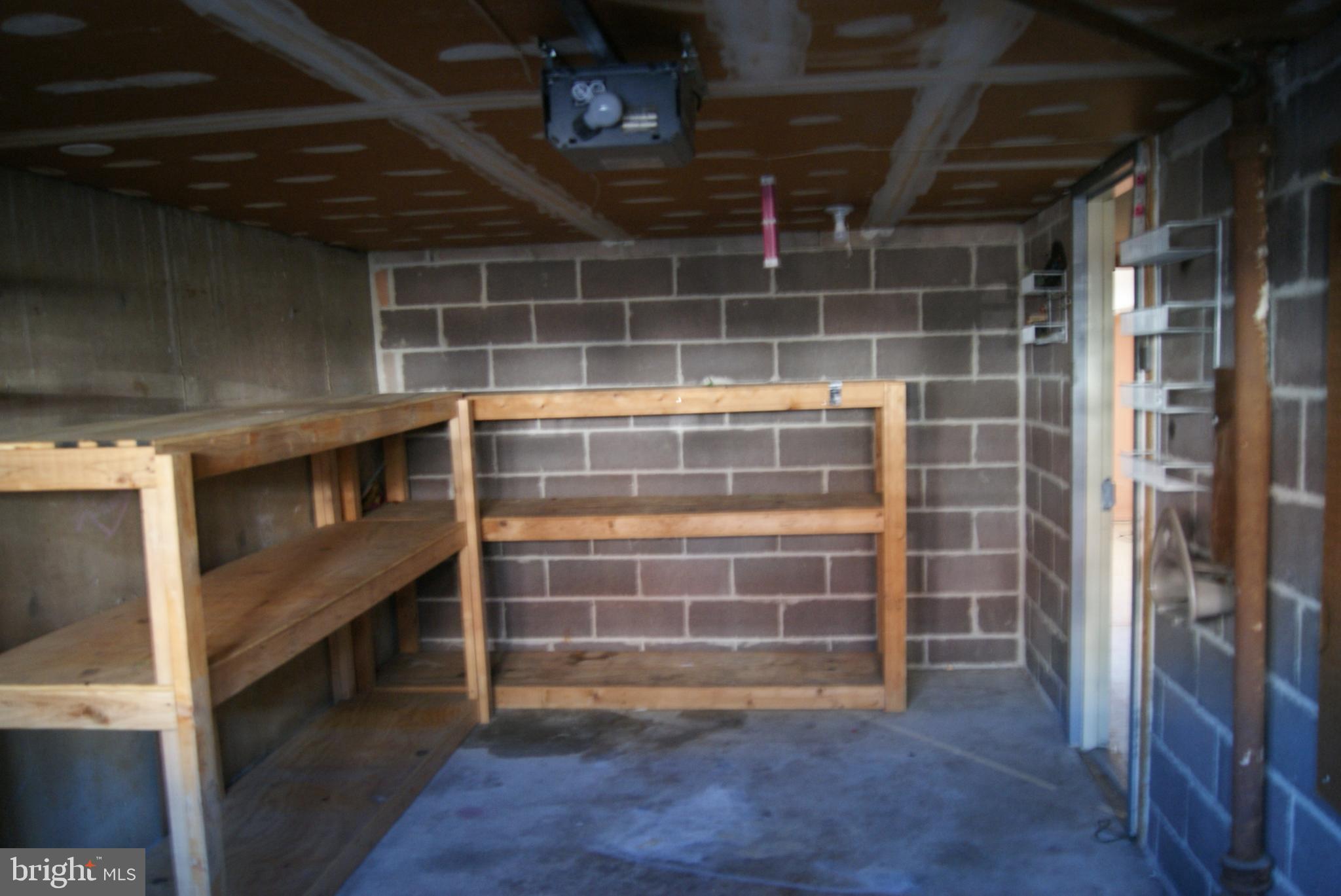 7314 Hill Road Philadelphia, PA 19128 - Photo 38 of 68 a view of an empty room with wooden floor and a window