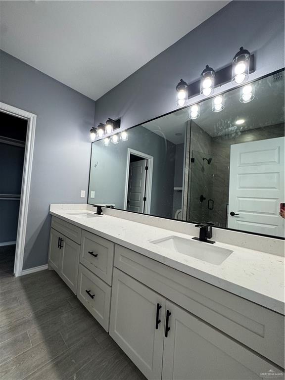 17962 Redwood Street Harlingen, TX 78552 - Photo 10 of 14 a bathroom with a sink double vanity and a mirror