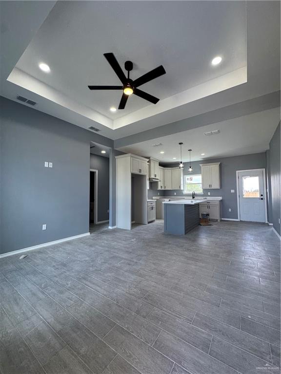 17962 Redwood Street Harlingen, TX 78552 - Photo 13 of 14 a view of a livingroom with a ceiling fan and window