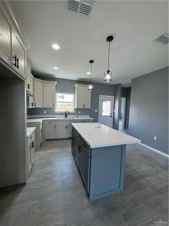 a view of a livingroom with a ceiling fan and window