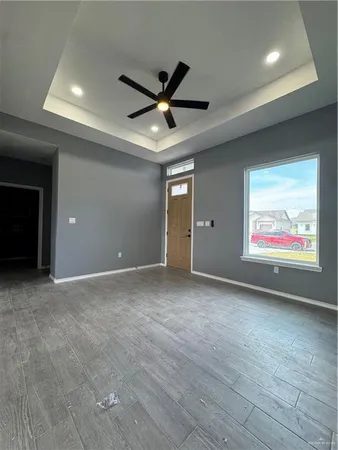 a living room with furniture window and wooden floor