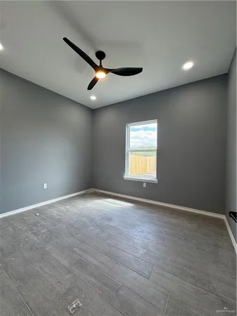 a large kitchen with kitchen island a sink stainless steel appliances and cabinets