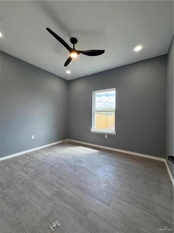 17962 Redwood Street Harlingen, TX 78552 - Photo 5 of 14 an empty room with windows