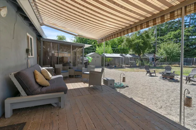 a view of a house with a yard porch and sitting area