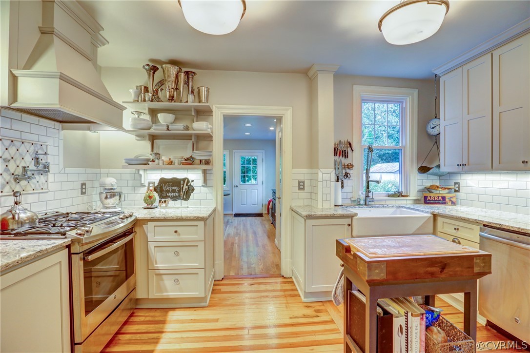 4227 Brook Road Richmond, VA 23227 - Photo 15 of 41 a kitchen that has a lot of cabinets in it and wooden floors